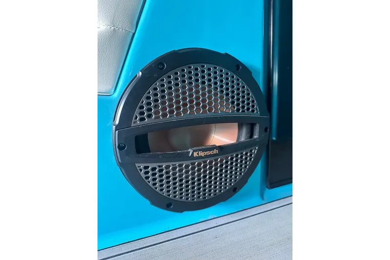 Slide: The Image of 2024 MasterCraft NXT22 boat featuring a Klipsch speaker on a blue interior panel. - 17