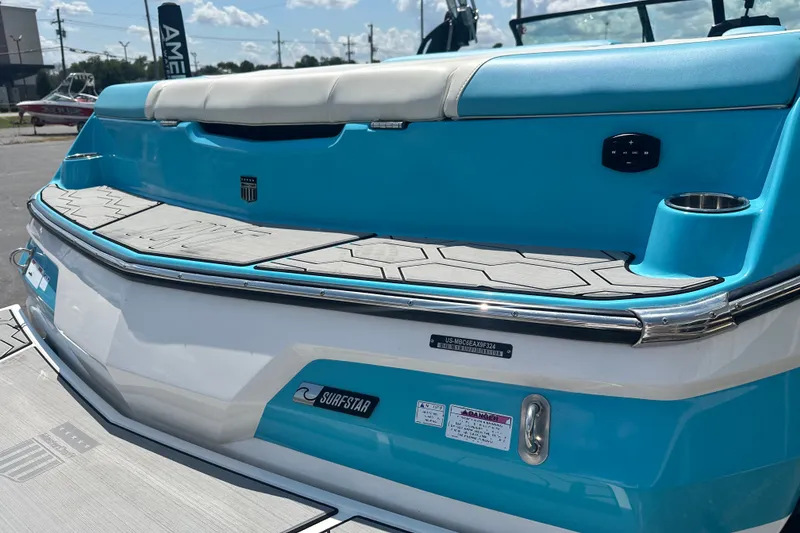 Slide: The Image of 2024 MasterCraft NXT22 boat with blue and white design, featuring SurfStar technology. - 6