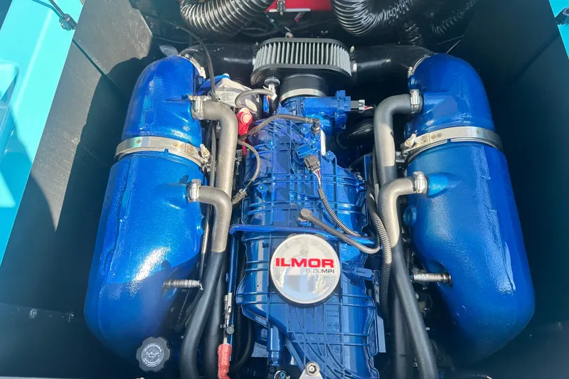 Slide: The Image of 2024 MasterCraft NXT22 Ilmor engine, blue components, detailed view. - 15