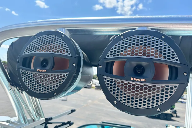 Slide: The Image of Klipsch speakers on 2024 MasterCraft NXT22 boat, mounted under a clear blue sky. - 16