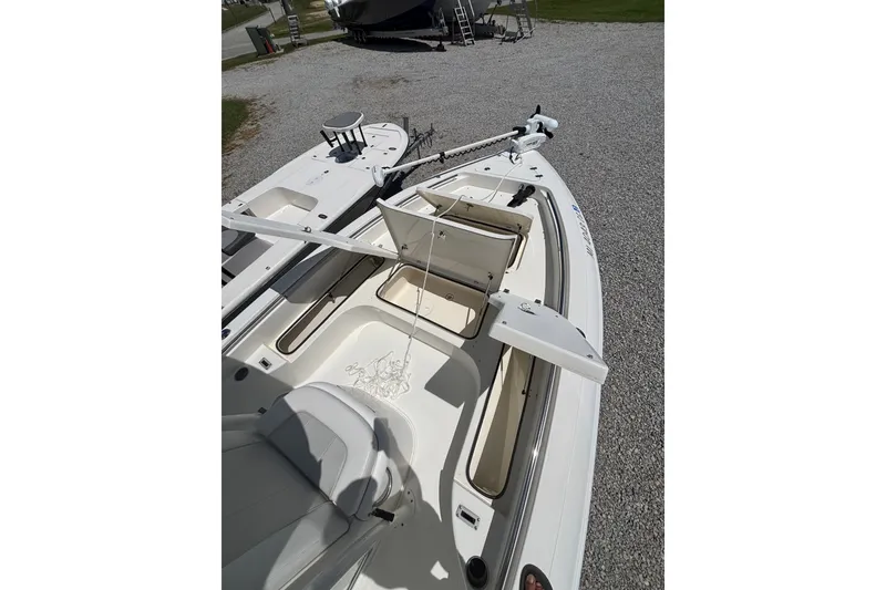 Slide: The Image of 2022 ShearWater 250 XTE boat interior with open storage compartments. - 5