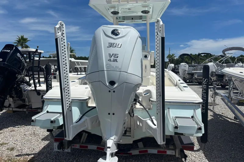 Slide: The Image of 2022 ShearWater 250 XTE boat with Yamaha V6 300 engine, displayed outdoors. - 3