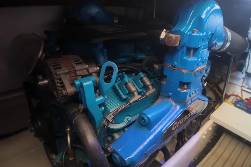 Slide: The Image of Engine of a 2006 Silverton 35 Motor Yacht, featuring a blue Crusader motor. - 22