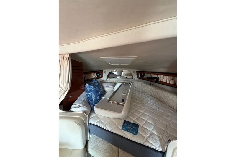 Slide: The Image of Interior cabin of 2005 Sea Ray Sundancer 280 with cozy bedding and nautical decor. - 26