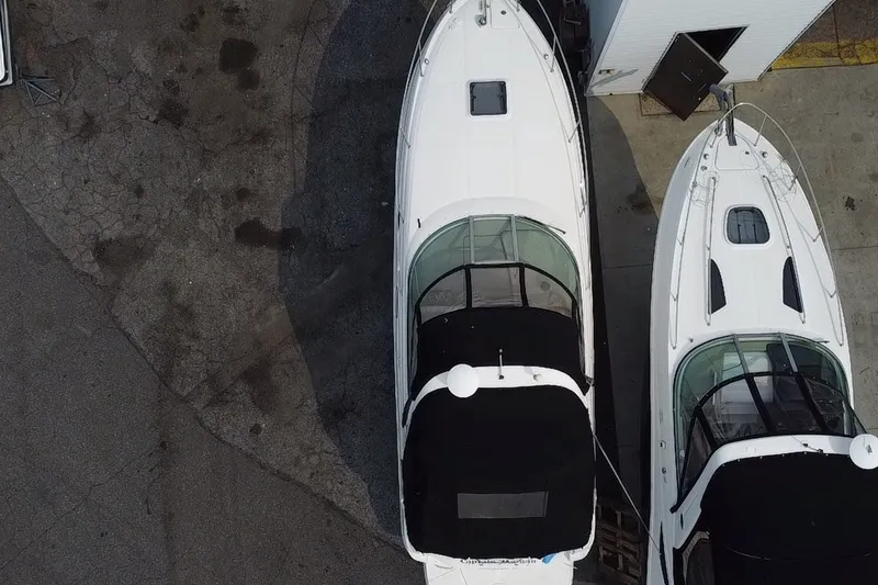 Slide: The Image of Aerial view of two 2005 Sea Ray Sundancer 280 boats docked side by side. - 13