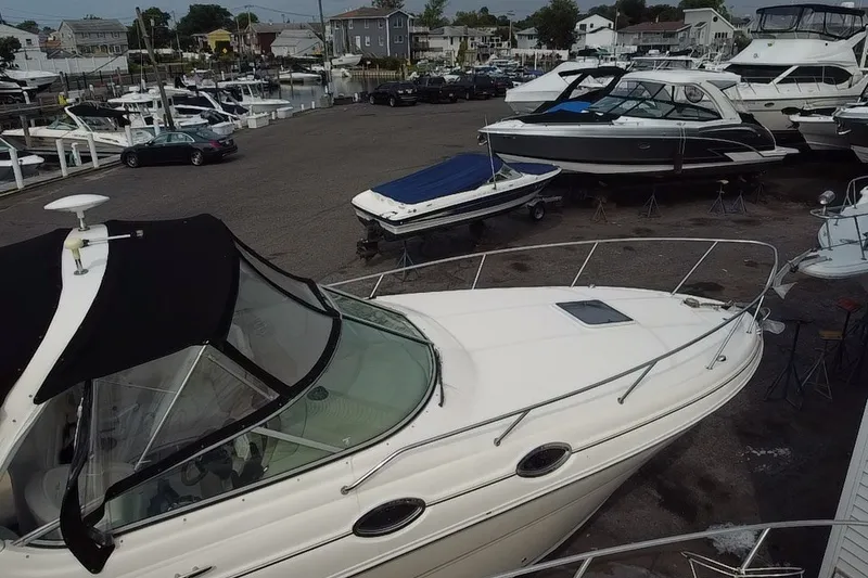 Slide: The Image of 2005 Sea Ray Sundancer 280 docked at marina with other boats. - 8