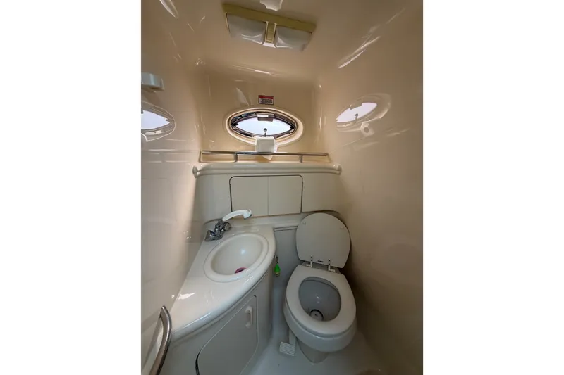 Slide: The Image of Compact bathroom in 2005 Sea Ray Sundancer 280 yacht with sink and toilet. - 30