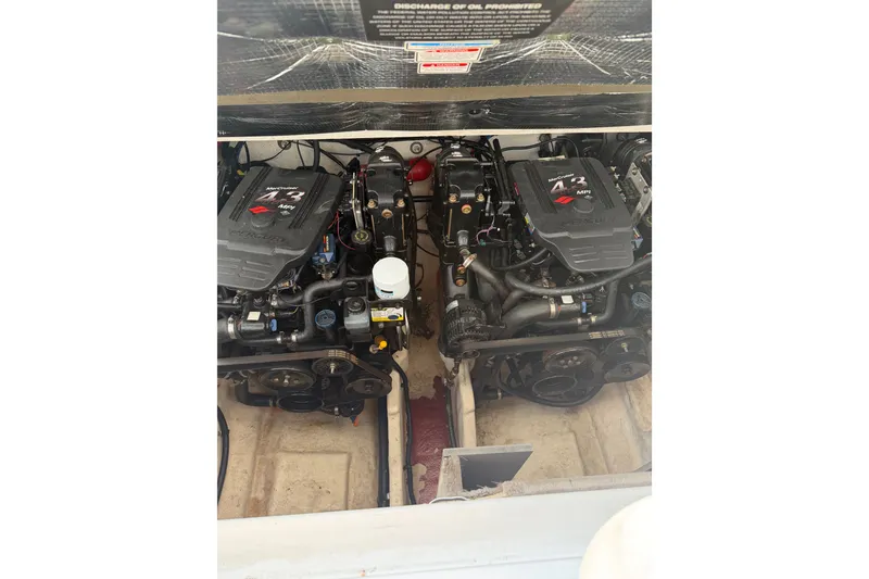 Slide: The Image of Twin MerCruiser engines in a 2005 Sea Ray Sundancer 280 boat engine compartment. - 31