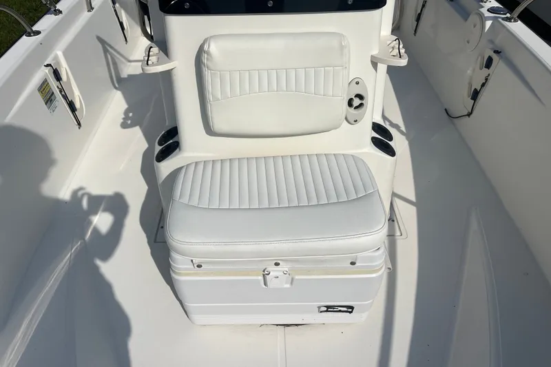 Slide: The Image of 2007 Boston Whaler 180 Dauntless boat interior with white cushioned seating. - 4