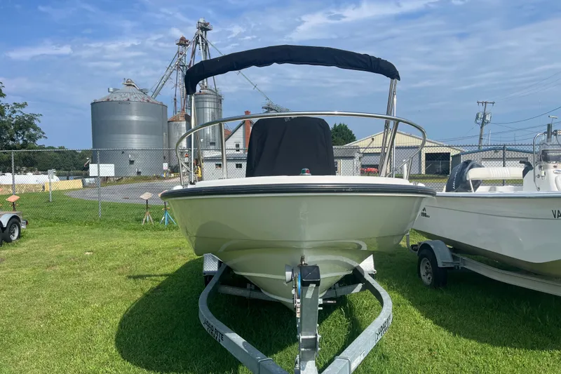 Slide: The Image of 2007 Boston Whaler 180 Dauntless boat on trailer, industrial background. - 15