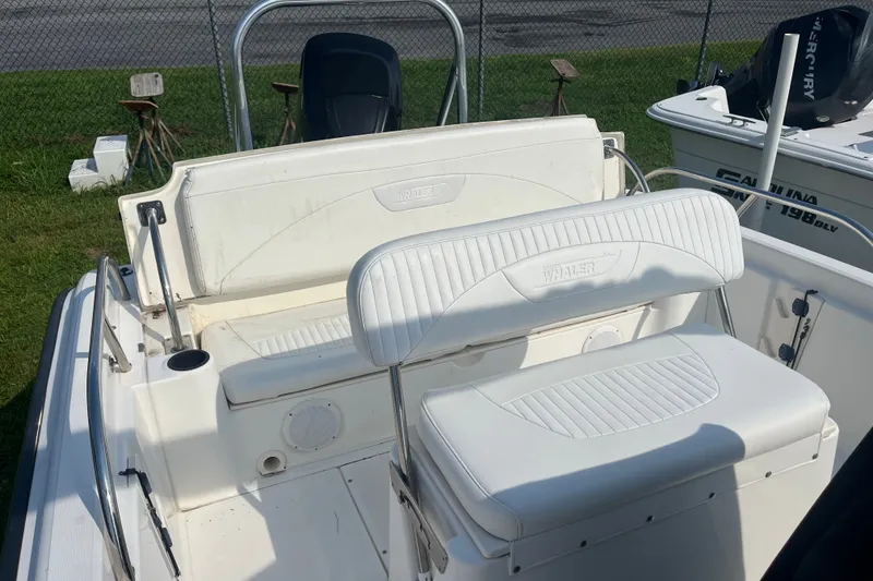 Slide: The Image of 2007 Boston Whaler 180 Dauntless boat interior with white seating and stainless steel railings. - 3