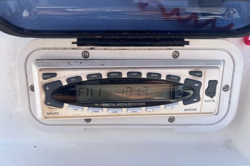 Slide: The Image of Marine digital media receiver on a 2007 Boston Whaler 180 Dauntless boat dashboard. - 11