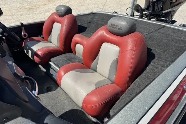 Slide: The Image of 2013 Skeeter FX21 boat interior with red and gray seats, showcasing sleek design. - 9