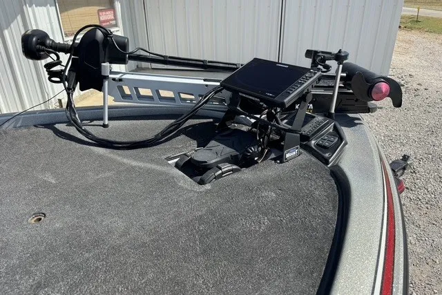 Slide: The Image of 2013 Skeeter FX21 boat deck with advanced fishing electronics and trolling motor setup. - 8