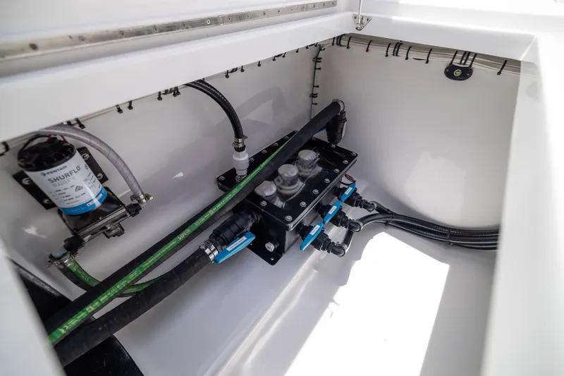 Slide: The Image of Engine compartment of 2026 Front Runner 43 Catamaran showcasing plumbing and pump system. - 57