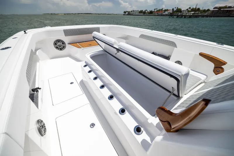 Slide: The Image of Luxurious 2026 Front Runner 43 Catamaran interior with seating and storage, docked by the water. - 16