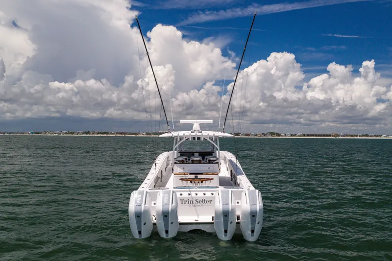 Slide: The Image of 2026 Front Runner 43 Catamaran on open water under a cloudy sky. - 6