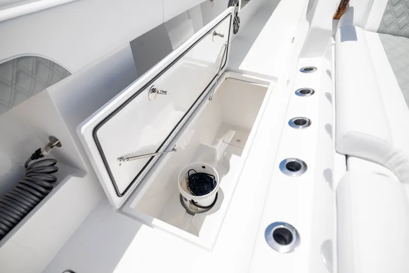 Slide: The Image of Open storage compartment on 2026 Front Runner 43 Catamaran, featuring sleek white design. - 29