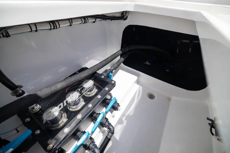 Slide: The Image of Engine compartment of 2026 Front Runner 43 Catamaran with visible wiring and components. - 59