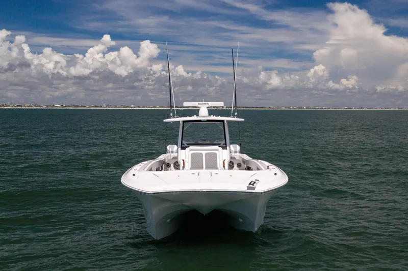 Slide: The Image of 2026 Front Runner 43 Catamaran on open water under a partly cloudy sky. - 5