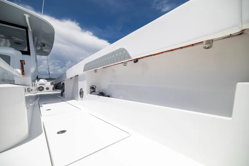 Slide: The Image of 2026 Front Runner 43 Catamaran deck view under clear blue sky. - 30