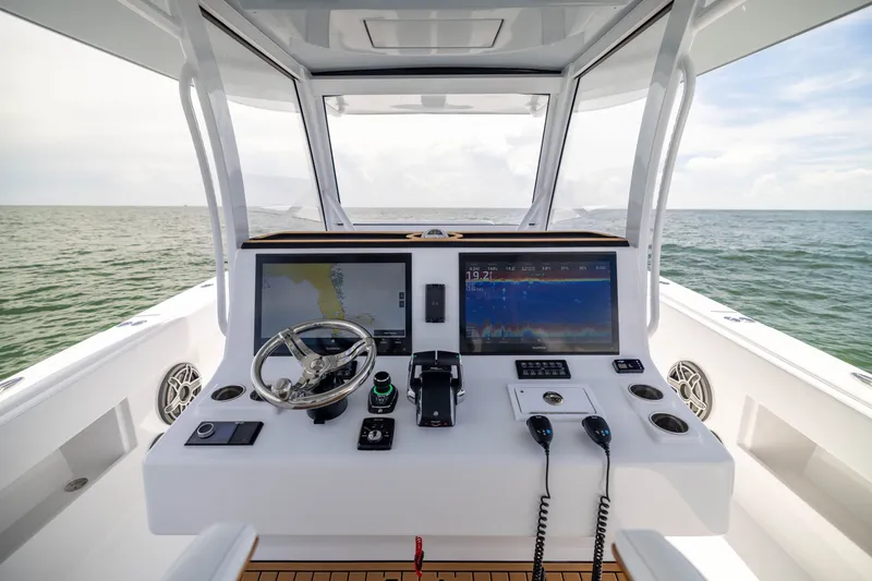 Slide: The Image of Cockpit of 2026 Front Runner 43 Catamaran with advanced navigation systems. - 38