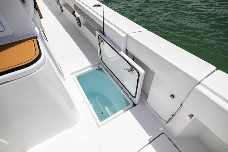 Slide: The Image of Open storage compartment on 2026 Front Runner 43 Catamaran, showcasing sleek design and functionality. - 48