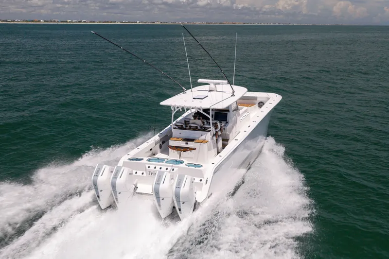 Slide: The Image of Front Runner 43 Catamaran 2026 cruising on open water, showcasing powerful engines and sleek design. - 9