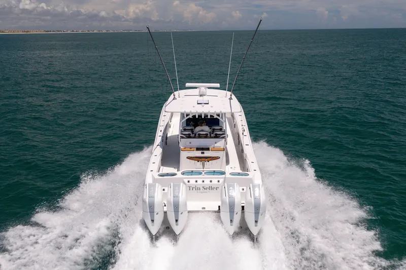 Slide: The Image of 2026 Front Runner 43 Catamaran cruising on open sea, rear view. - 10