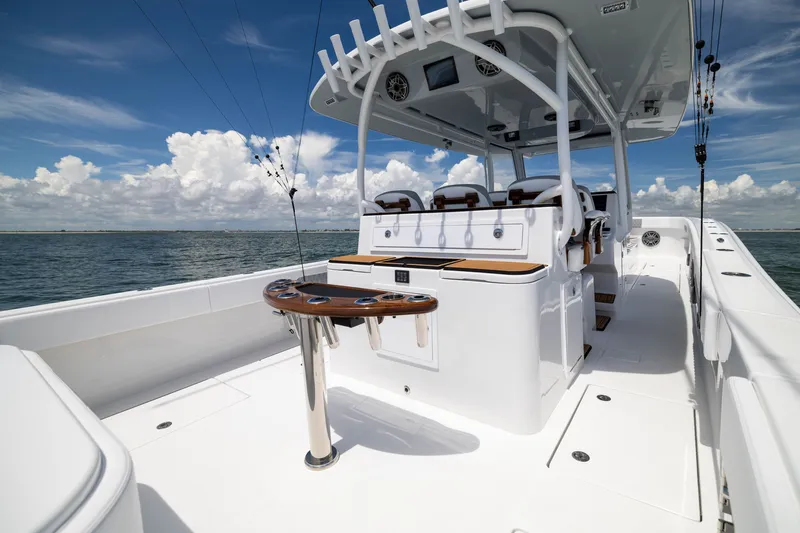 Slide: The Image of 2026 Front Runner 43 Catamaran with sleek deck design and modern seating on open water. - 43