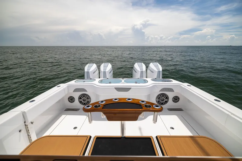 Slide: The Image of 2026 Front Runner 43 Catamaran with triple engines, ocean view, and sleek deck design. - 50