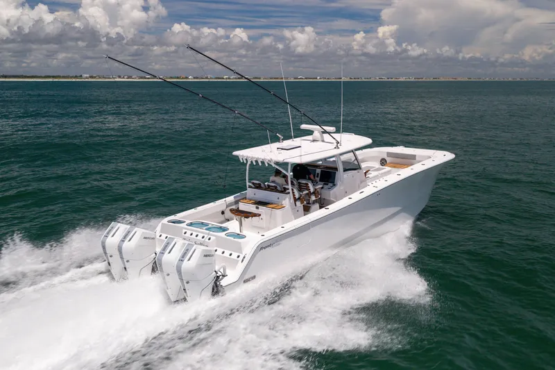 Slide: The Image of 2026 Front Runner 43 Catamaran cruising on open water under a partly cloudy sky. - 12