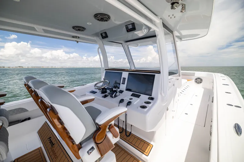 Slide: The Image of Luxurious 2026 Front Runner 43 Catamaran helm with advanced navigation systems and ocean view. - 37