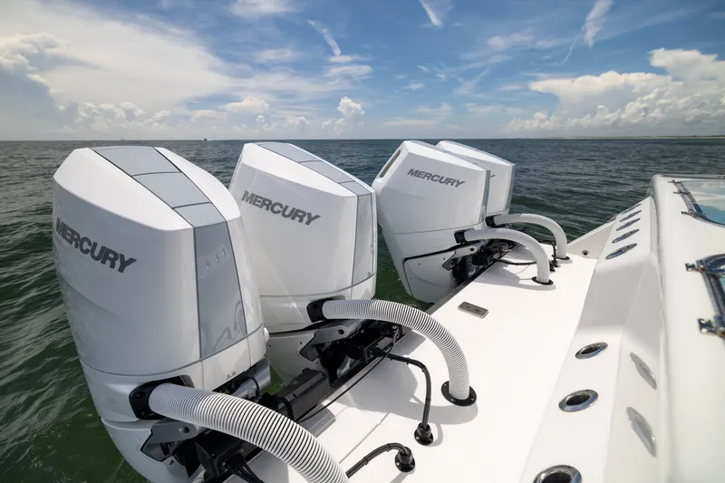 Slide: The Image of Triple Mercury outboard engines on a 2026 Front Runner 43 Catamaran, ocean backdrop. - 55