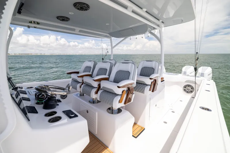 Slide: The Image of Luxurious 2026 Front Runner 43 Catamaran with plush seating and advanced controls on open water. - 32