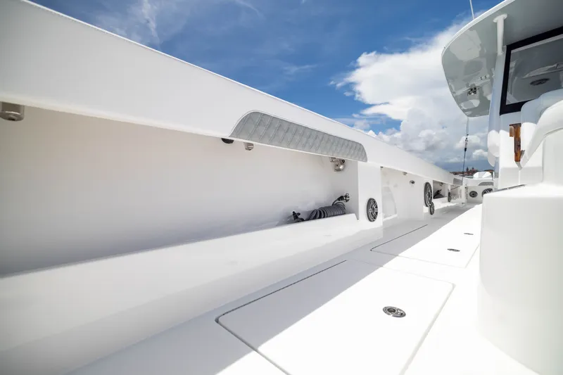 Slide: The Image of 2026 Front Runner 43 Catamaran deck with storage compartments and sleek design. - 31