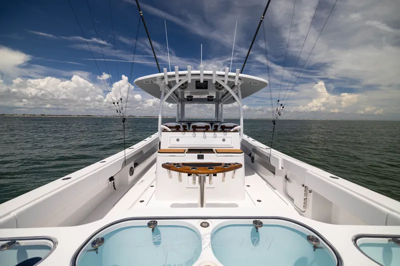 Slide: The Image of 2026 Front Runner 43 Catamaran on open water, showcasing sleek design and fishing setup. - 41