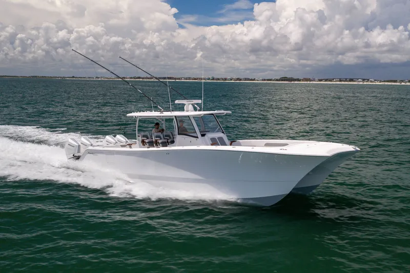 Slide: The Image of 2026 Front Runner 43 Catamaran cruising on open water under cloudy skies. - 8