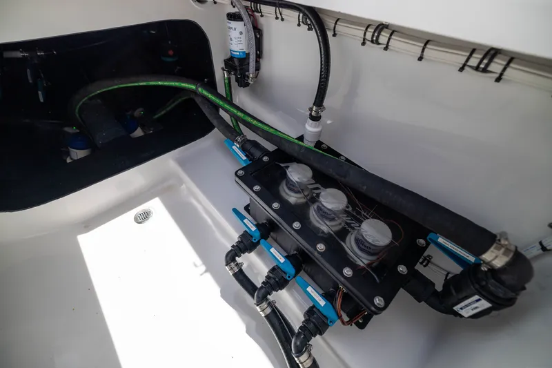 Slide: The Image of Engine compartment of 2026 Front Runner 43 Catamaran showcasing hoses and filtration system. - 58
