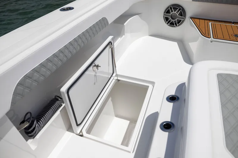 Slide: The Image of 2026 Front Runner 43 Catamaran deck with open storage compartment and speaker. - 21