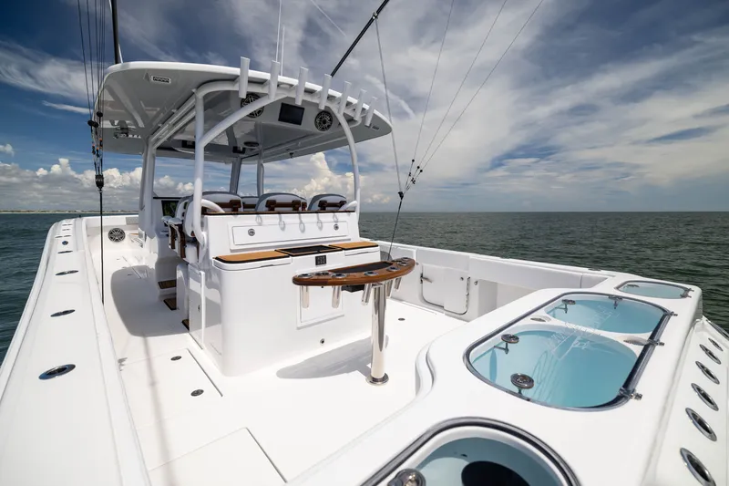 Slide: The Image of 2026 Front Runner 43 Catamaran on open water, showcasing sleek design and spacious deck. - 42