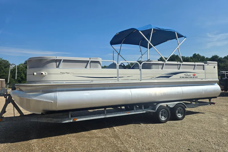 The Image of 2007 Sun Tracker Party Barge 27 Regency Edition pontoon boat on trailer. - 1