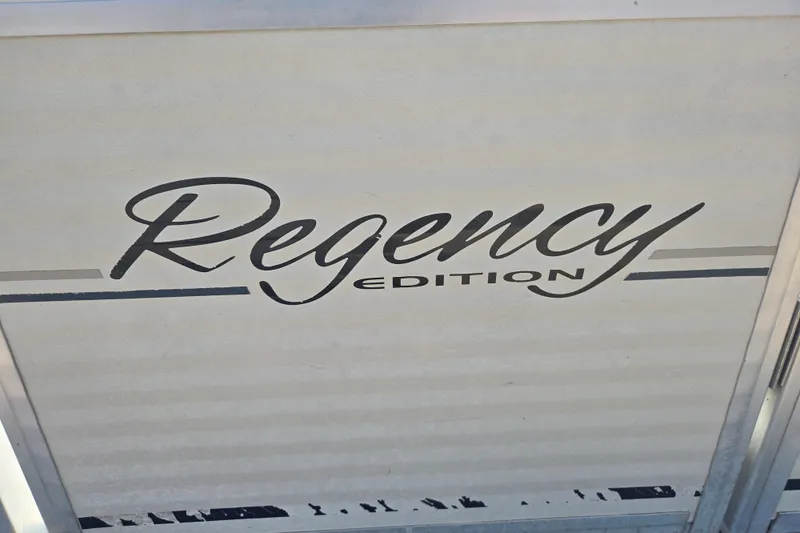 Slide: The Image of 2007 Sun Tracker Party Barge 27 Regency Edition logo on boat surface. - 18