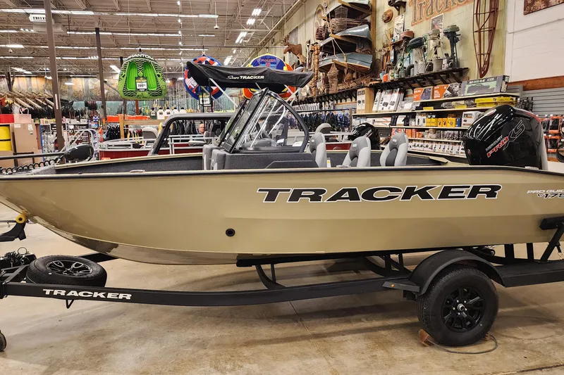 The Image of 2027 Tracker Pro Guide V-175 Combo boat displayed in a showroom. - 0