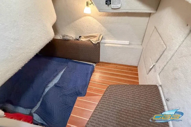 Slide: The Image of Cozy interior cabin of 2013 Cutwater C-28 boat with wooden flooring and soft lighting. - 48
