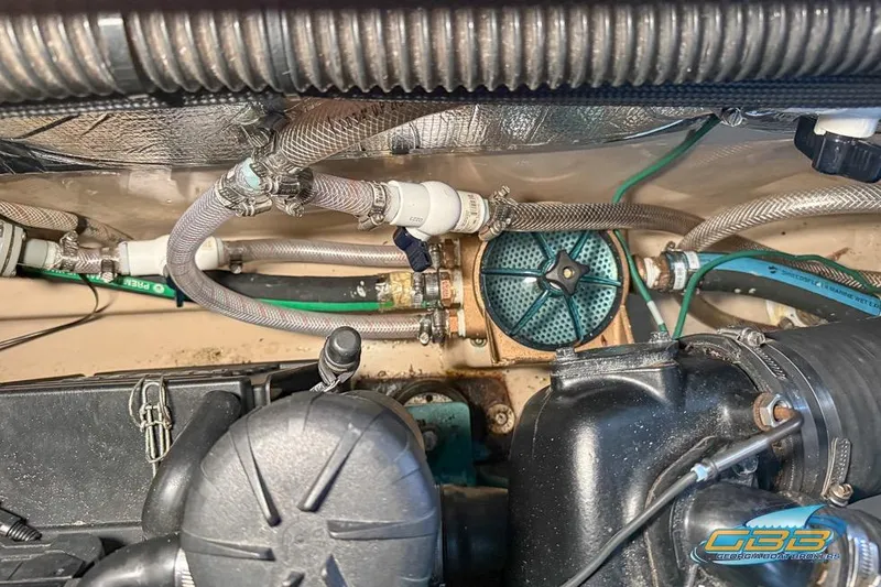 Slide: The Image of Engine compartment of a 2013 Cutwater C-28 boat, showing hoses and mechanical components. - 74