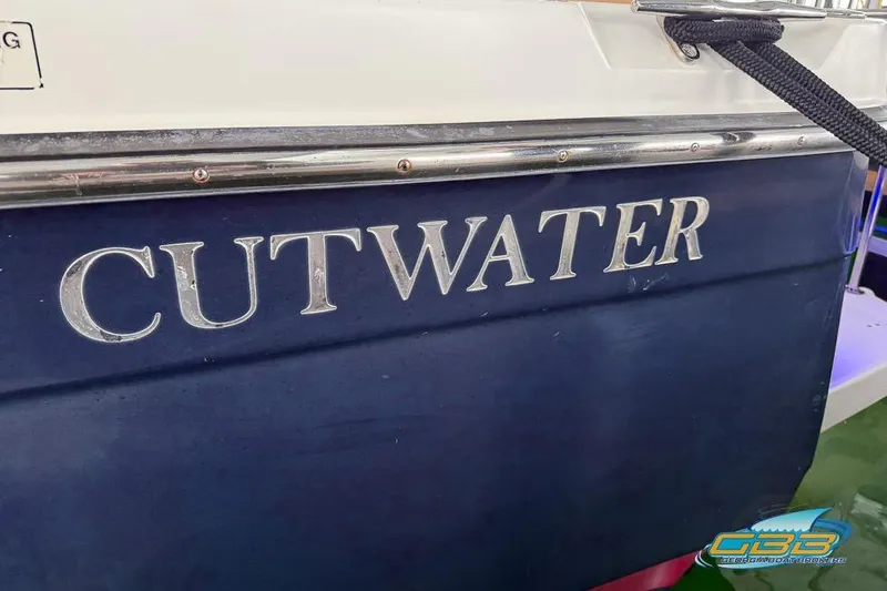 Slide: The Image of 2013 Cutwater C-28 boat with blue hull and silver lettering. - 81