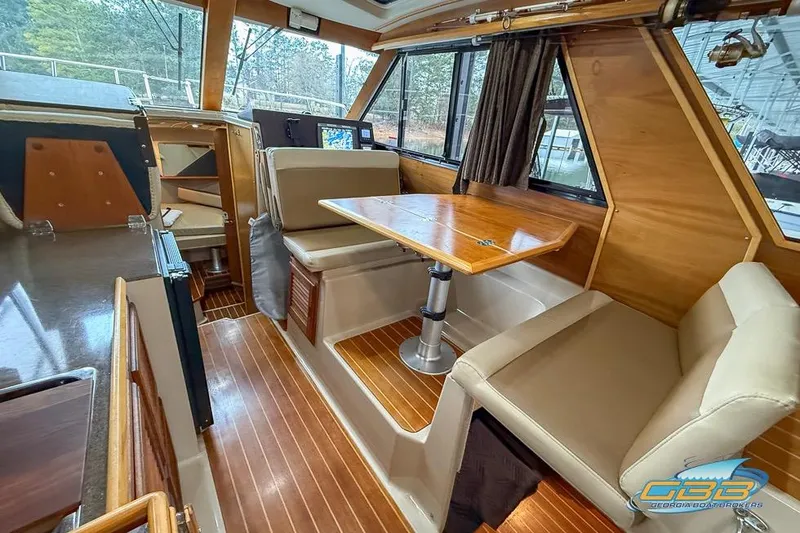 Slide: The Image of Interior of 2013 Cutwater C-28 boat with wood accents and seating area. - 23