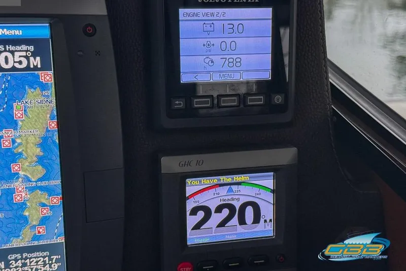 Slide: The Image of Dashboard of a 2013 Cutwater C-28 boat with navigation and engine displays. - 36