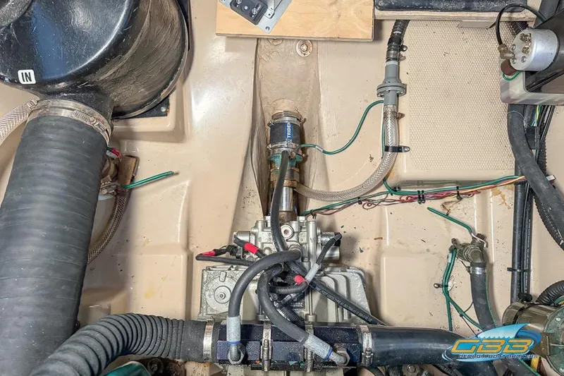 Slide: The Image of Engine compartment of a 2013 Cutwater C-28 boat, showing hoses and mechanical components. - 71